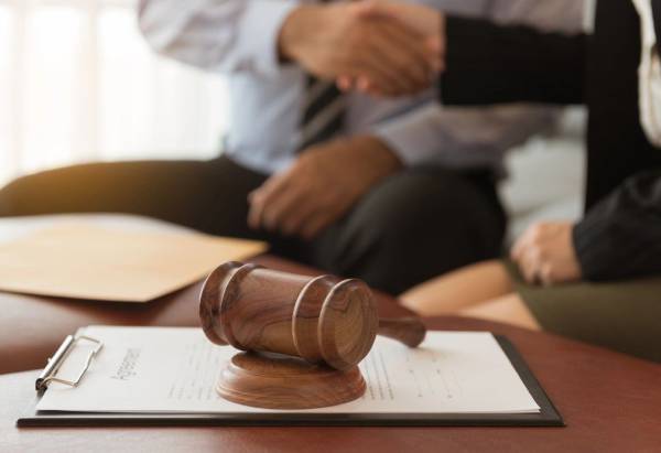 A judge 's gavel sitting on top of a table.